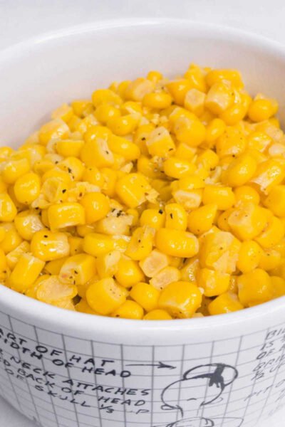 canned corn that has been cooked in a bowl.