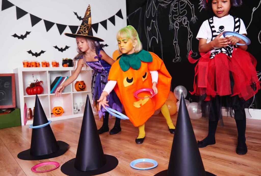 Kids playing witch hat ring toss.